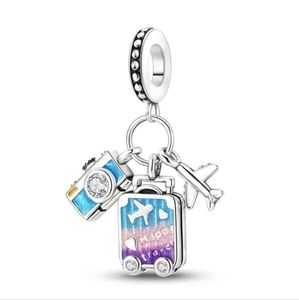 Travel charm with suitcase